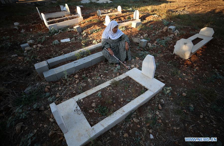 MIDEAST-NABLUS-CEMETERY-EID AL-FITR