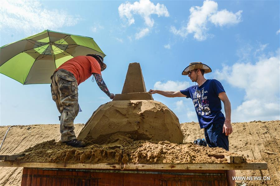 The sand sculptures here are expected to open to the public on Sept. 9. 